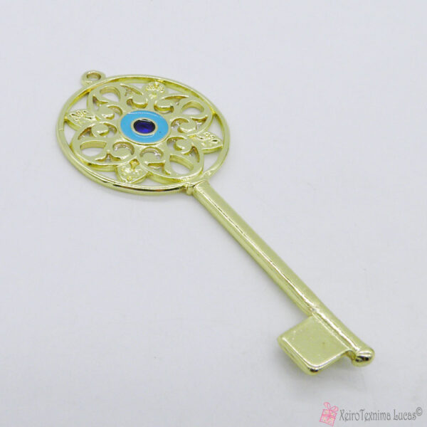Χρυσό μεταλλικό κλειδί με μπλε μάτι σμάλτο