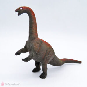 Παιχνίδι δεινόσαυρος σε γκρί-κόκκινο χρώμα
