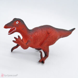Παιχνίδι δεινόσαυρος σε κόκκινο χρώμα